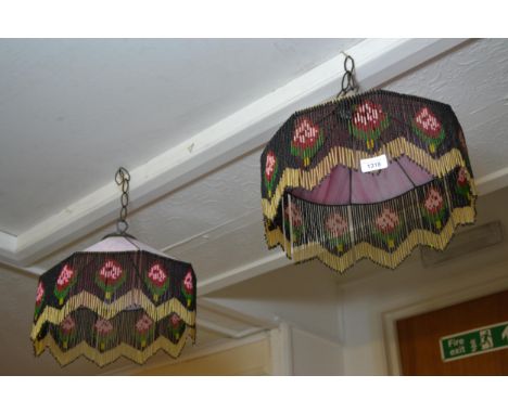 Pair of pink glass and beaded lampshades, together with a bronzed metal table lamp and a gourd lampshade 