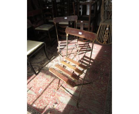 Pair of French wooden slatted and iron cafe chairs, bearing enamel label for ' Alain Menagerie ' 