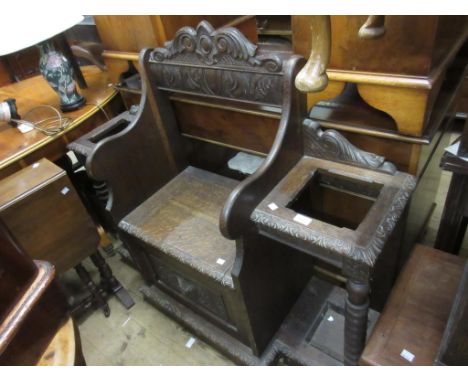 Victorian carved oak hall bench / stickstand, the shaped carved back above a box seat flanked by bobbin turnings above a carv