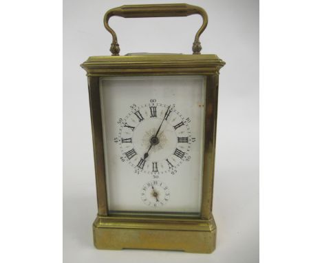 Late 19th Century French gilt brass carriage clock, the enamel dial with Roman and Arabic numerals and subsidiary alarm dial,