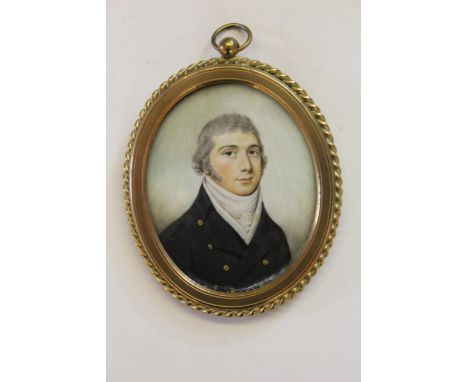 Early 19th Century oval portrait miniature of a naval officer in uniform, mounted in an oval gilt metal frame with rope twist