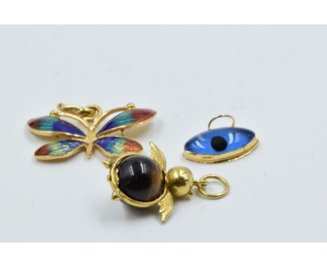 Enamel butterfly charm and two others 