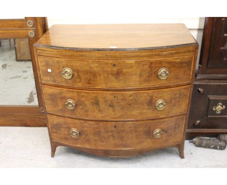 George III mahogany bow fronted chest, with brushing slide and three long drawers on splayed supports, 35ins high x 39ins wid