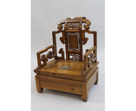 Mid 20th Century Chinese low seat armchair having floral carved and pierced panelled back and scroll work decoration, with pa