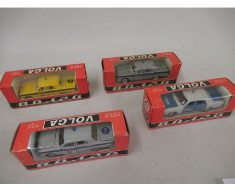 Group of four Russian Volga boxed diecast metal model vehicles 