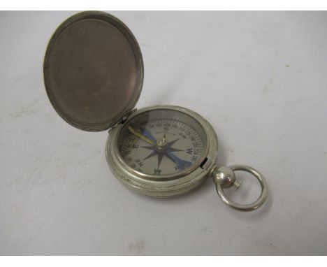 20th Century steel cased compass with silvered dial, inscribed Whittnauer, the outer case stamped U.S 