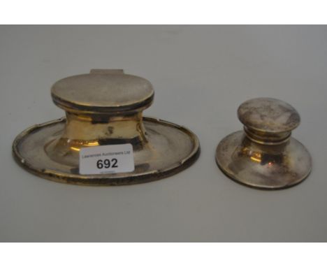 Birmingham silver oval capstan inkwell with hinged cover, 5.5ins wide together with a similar smaller capstan inkwell 