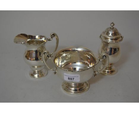 Dublin silver cream jug, sugar basin and sugar caster, 1915, 18.5 troy oz, maker West & Son 