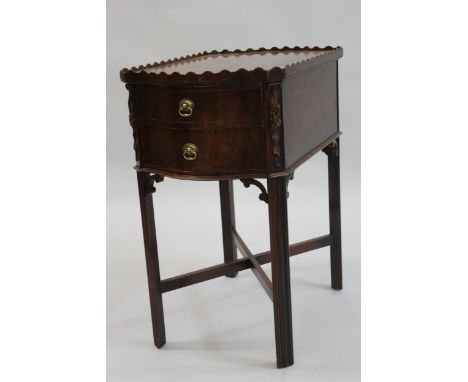 20th Century American mahogany lamp table with gallery top above two end drawers, raised on moulded chamfered supports 