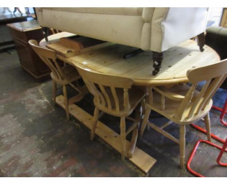 Modern pine oval draw leaf table with two extra leaves on twin baluster column support with cabriole legs and a set of eight 