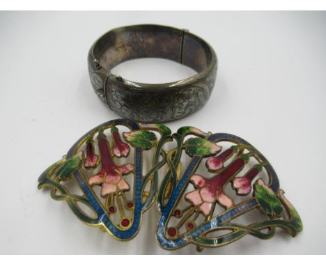 Gilt metal and enamel decorated buckle of floral design, together with a silver bangle 