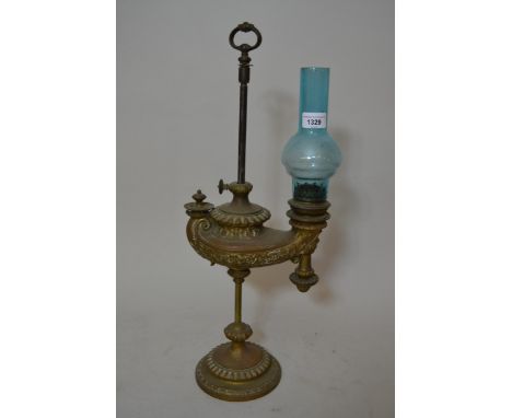 Late 19th / Early 20th Century Brass adjustable desk oil lamp on circular base, with later blue glass chimney, 22.5ins high (