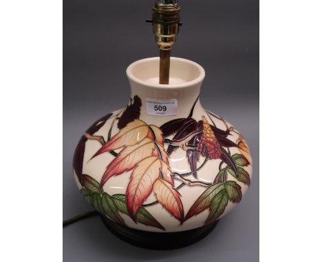 Modern Moorcroft table lamp decorated with Autumn berries and foliage on a cream ground, 7.5ins high approximately excluding 
