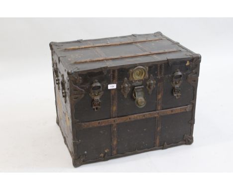 Late 19th Century canvas covered trunk, having cast iron mounts and wooden slatted, bearing a plaque inscribed ' The New Atla