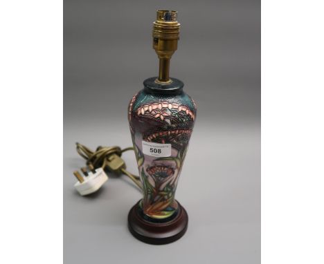 Modern Moorcroft baluster form table lamp with a typical stylised floral design, 8ins high excluding the wooden base and meta