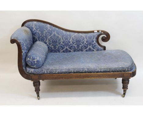 Regency mahogany chaise longue, the frame having reeded scroll work design and blue damask upholstery, with loose cushion and