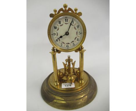 Brass three hundred day clock, the floral decorated enamel dial with Arabic numerals, beneath a glass display dome 