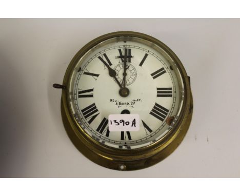 Kelvin Bottomley & Baird, ships circular brass bulk head clock with enamel dial, Roman numerals and subsidiary seconds, 6in d