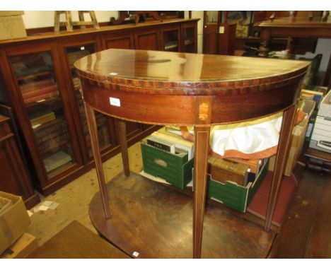 Edwardian mahogany and inlaid demi lune fold-over card table, on square tapering supports (with losses), 34ins wide x 17ins d