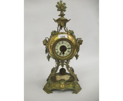 Ornate late 19th Century brass mantel clock with ceramic dial and Roman numerals, with a single train movement, 16ins high 