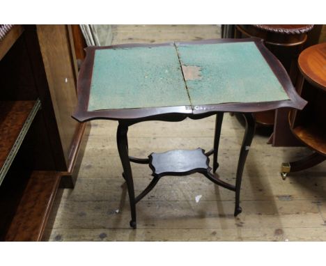 Small Edwardian mahogany card table, the shaped fold-over top above cabriole supports and undertier, 22.5ins wide 