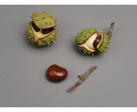 Modern porcelain model of a horse chestnut, makers mark CP (slight damage), together with another similar and another model o
