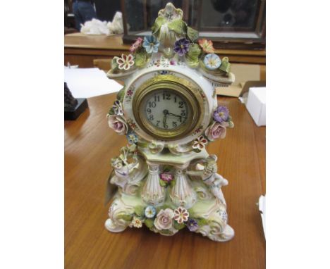 Small Continental porcelain cherub mounted mantel clock (at fault) 