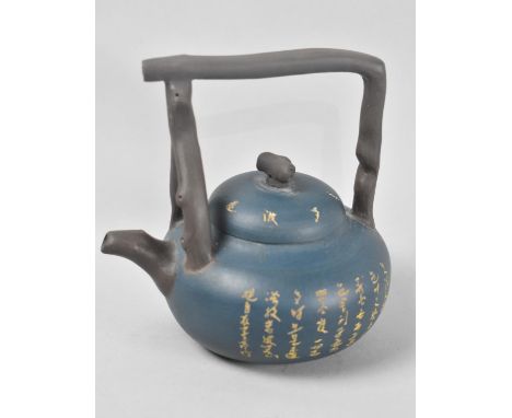 A Chinese Blue Ground Yixing Teapot with Calligraphy Decoration and Stylised Handle, Seal Mark to Base, 13cm high 