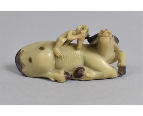 A Late 19th Century Chinese Carved Soapstone Model of a Buffalo, Modelled Recumbent with a Monkey on Back, 9cm wide 