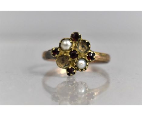 A Yellow Metal Ring with Claw Set Red Stones and Pearl, Two Stones Missing 