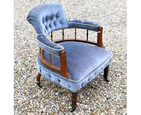 A late 19th/early 20th century walnut framed part button upholstered salon chair
