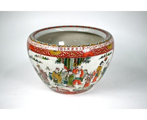 A 20th century Chinese famille verte jardiniere with a large panel on each side featuring the eight Daoist immortals in garde