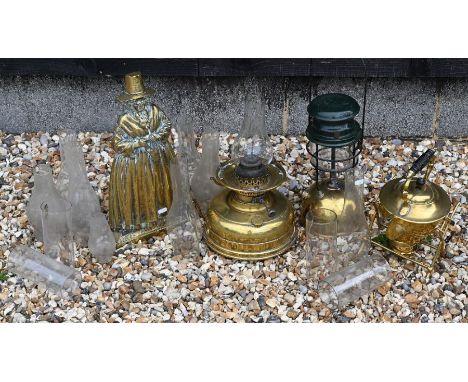 A box of antique brass including a Tilley oil lamp model X246A; a brass kettle on stand; a brass oil lamp; a brass figural do