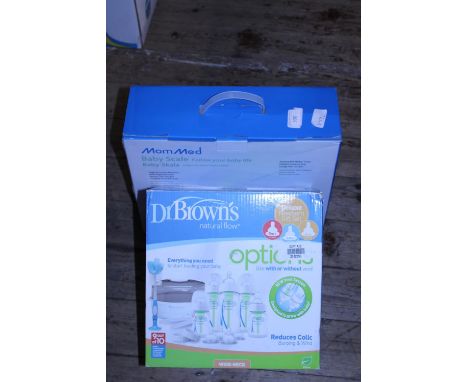 A boxed baby scale and a new Doctor Brown's baby bottle set 