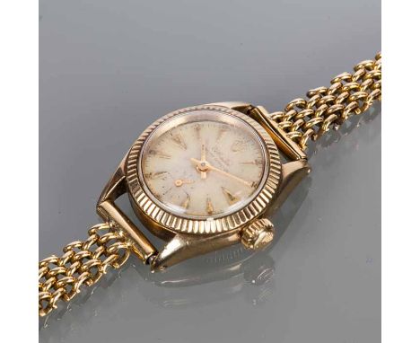 LADY'S EIGHTEEN CARAT GOLD ROLEX OYSTER PERPETUAL WRISTWATCH
model number 6509, signed automatic movement, the champagne dial
