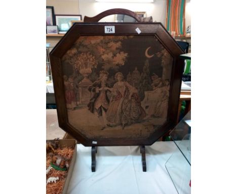 An Edwardian oak frame fire screen with Classical tapestry centre panel