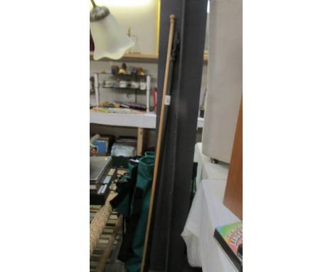 A wooden curten/tapestry pole 150cm and a black metal fleur de lys curtain pole with rings, no brackets. COLLECT ONLY.