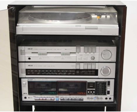 An Akai seperates stereo system, components to include FM/AM Stereo Tuner Model AT-K1L, Stereo Integrated Amplifier AM-U1 and