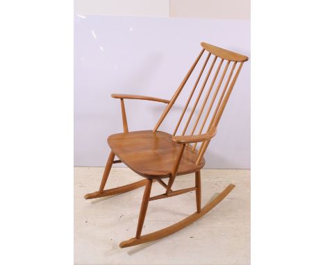 Ercol style rocking chair, label remnants to underside
