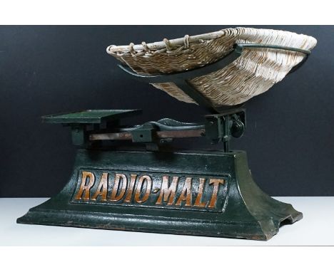 Set of vintage 20th century Radio-Malt advertising cast iron baby scales, with wicker basket, painted in green with gilt lett