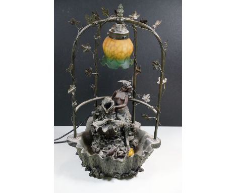 Art Nouveau style table lamp with coloured glass shade modelled as a mermaid and dolphin within a clam shell with arch surrou