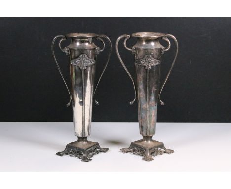 Pair of early 20th Century Art Nouveau silver plated vases, each having twin handles with flared rims, stylised floral detail
