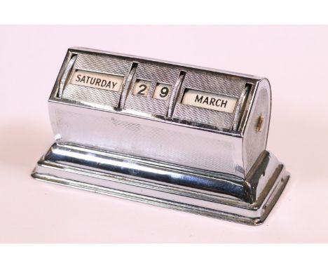 Early 20th century chrome plated desk calendar with engine turned decoration, 10cm long