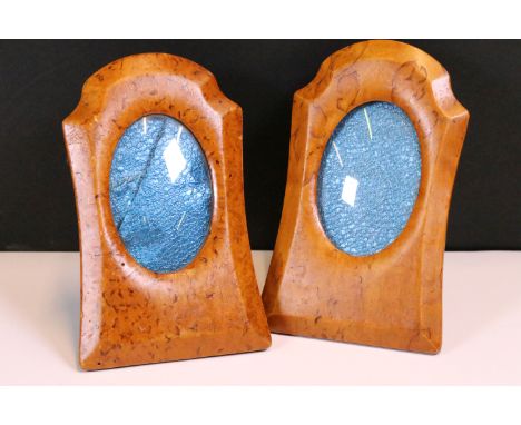 A pair of antique wooden desk top easel back photograph frames, oval apertures, stand approx 16cm in height.