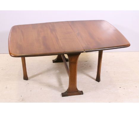 Ercol drop leaf table of small proportions, with maker's label, 46cm high x 102.5cm wide (extended) x 69cm deep