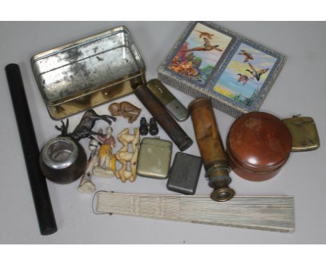 A mixed lot comprising a set of unused Pneumatic playing cards, a military issue oil can, two brass vesta cases, a treen scre