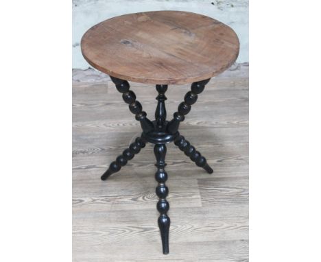 An ebonised and gilt bobbin gypsy table, height 66cm.Condition: some natural splits to wood on a couple of the bobbins as pic