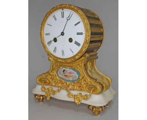 A 19th century gilt metal mantle clock, enamel dial with Roman numerals signed 'Rowell Oxford', diam. 13cm, above Sevres styl