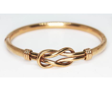 A 9ct gold bangle, import marks, diam. approx. 6cm, wt. 12.1g.  