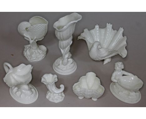 Seven pieces of Royal Worcester sea themed models comprising a nautilus shell, a tall vase of conical shell form, a half clam